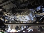 Front crossmember and rack and pinion removed, engine hanging from support beam.jpg